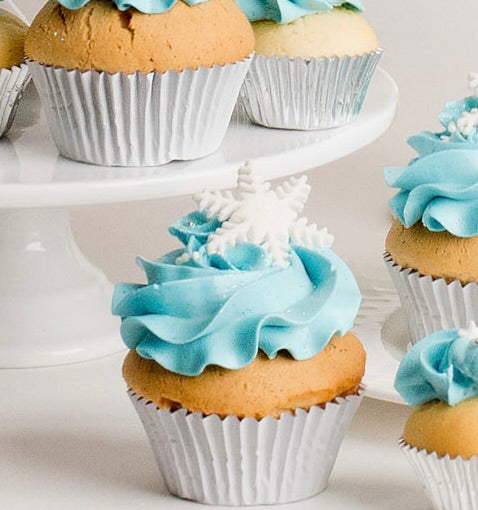 Cupcakes with light blue frosting, with a snow flake topper, perfect for a Disney Frozen themed birthday party, Birthday Cupcake Brisbane, Cute Cakes & Co,