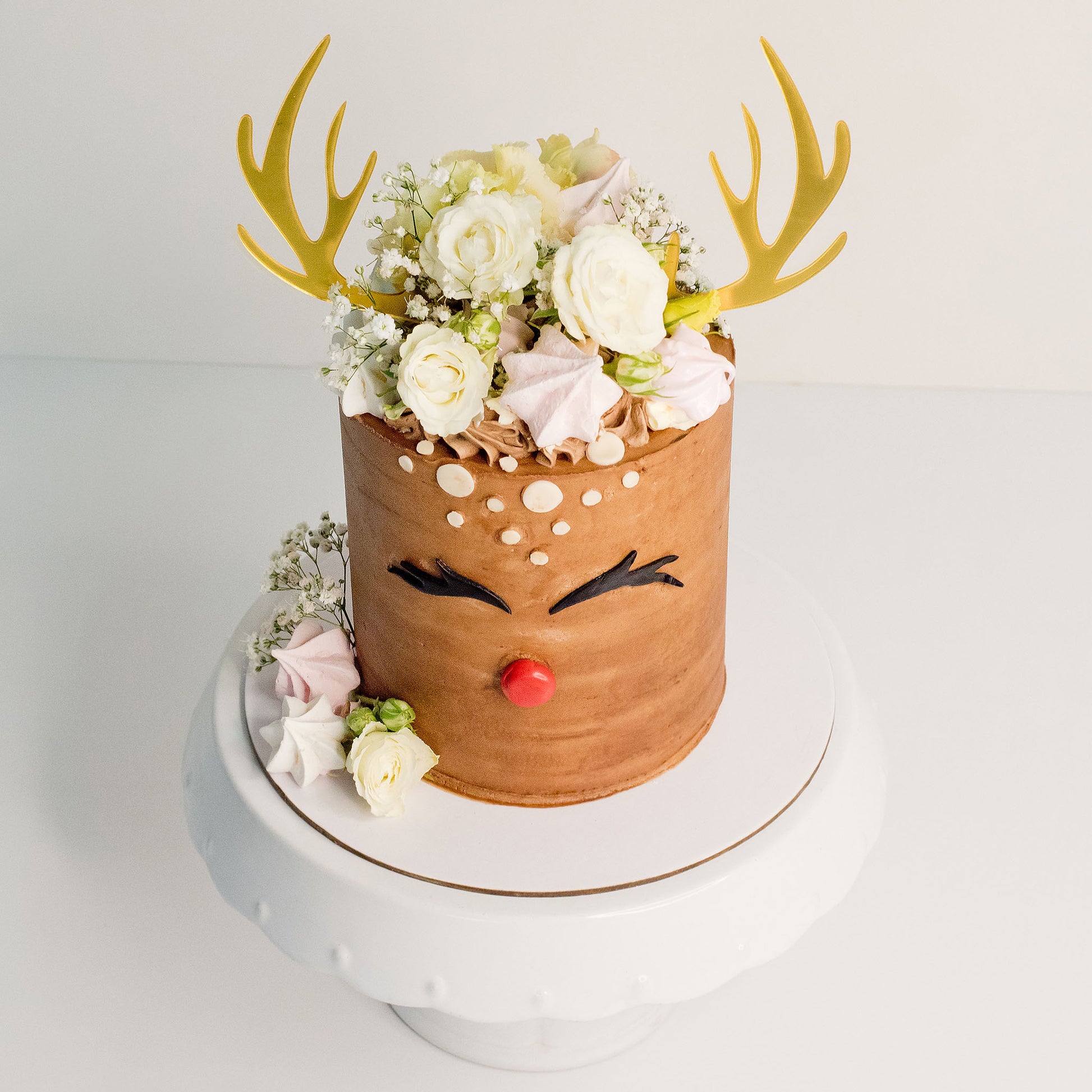 Celebrate Christmas with the fun cake - Rudolf the red nose dear. Christmas cakes Brisbane, birthday cakes Brisbane, cakes Brisbane cake shops Brisbane, cupcakes Brisbane, cake shop Brisbane, Cute Cakes & Co, Cute Cakes and Co