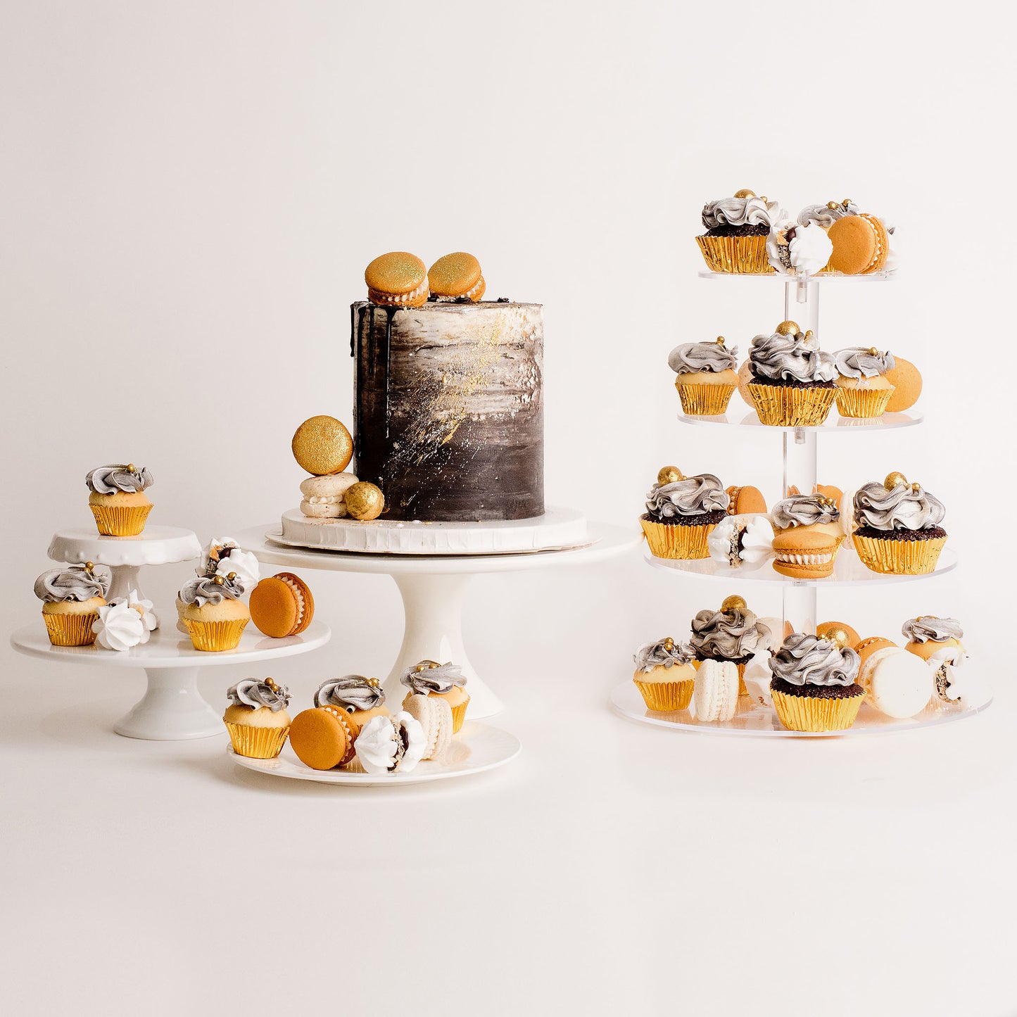 Cake, macaron and cupcakes dessert table package. Black, white and gold theme 
Looks fabulous, Made with love by Cute Cakes and Co. the 5 star review cake shop, in Brisbane.