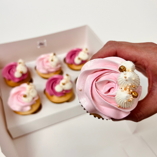 Delicious light pink and darker pink buttercream vanilla cupcakes with white and gold detail. Made by Cute Cakes and Co. Brisbane cake shop near you. Same day orders. We deliver to your door 