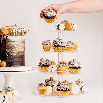 Cupcakes on a stand, with a hand hold one of them. Black, white and gold theme 
Looks fabulous, Made with love by Cute Cakes and Co. the 5 star review cake shop, in Brisbane.