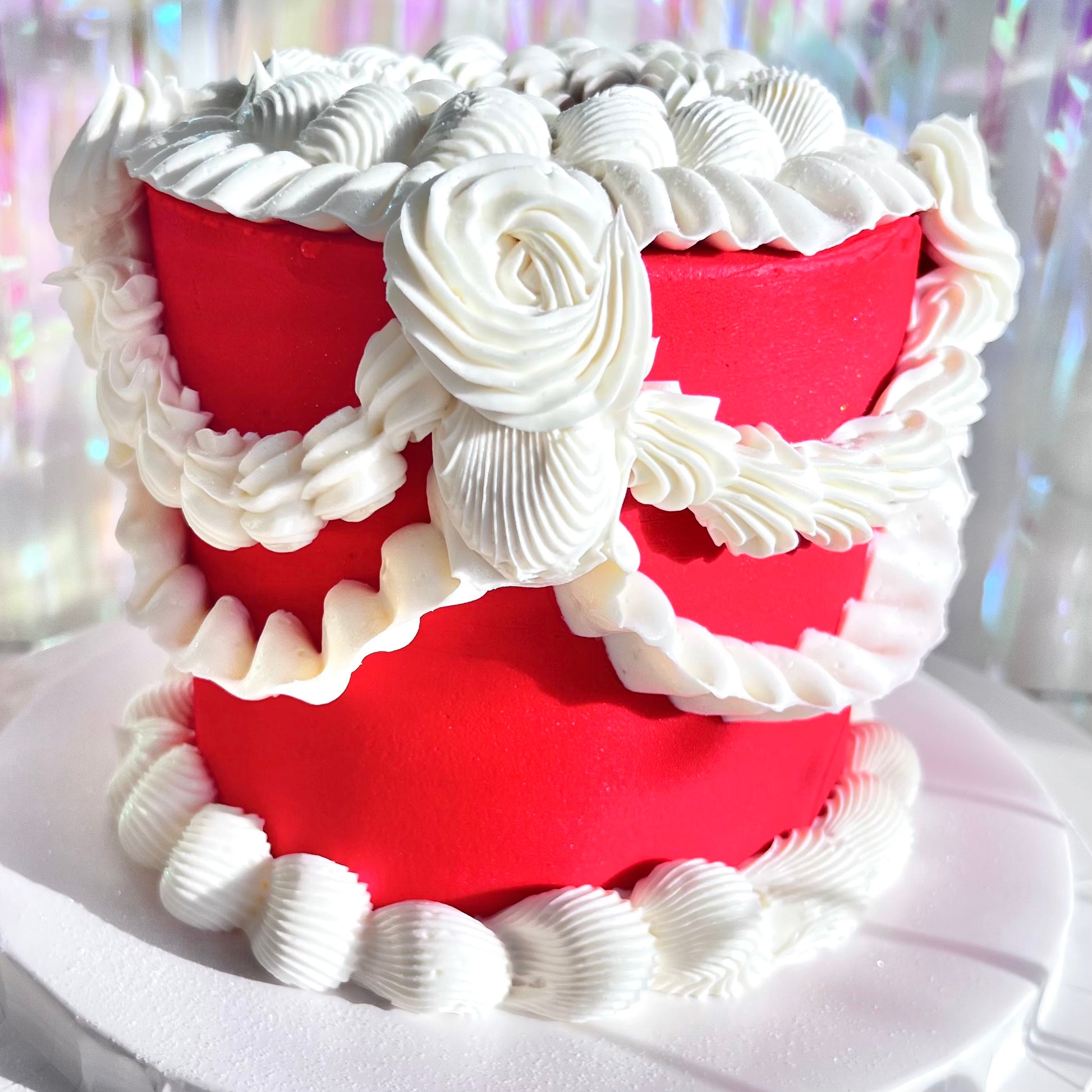 Red Marvellous Vintage birthday cake with white hand-piped buttercream 