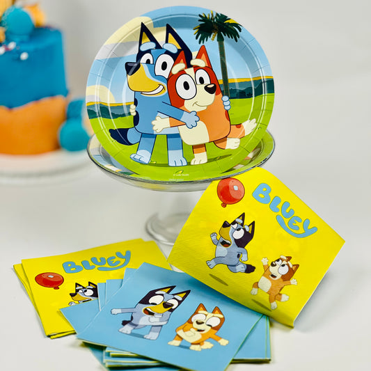 Party supplies with Bluey character design on plates and cards.