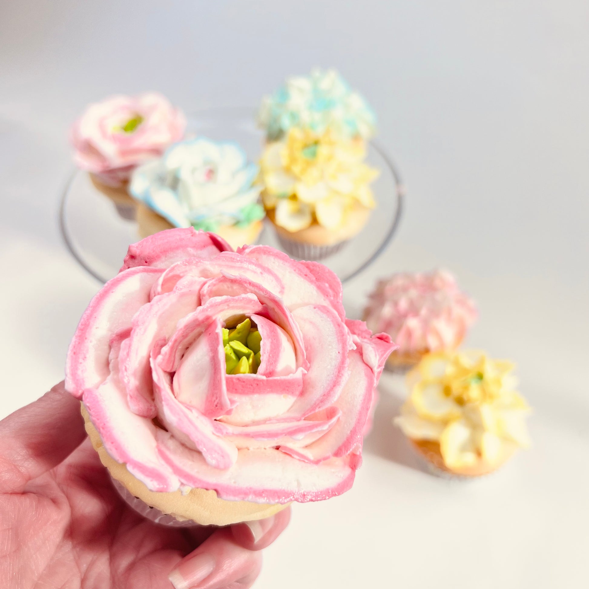 Close up of a pink rose cupcake