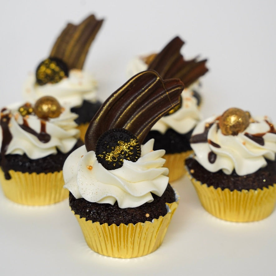 Delicious Chocolate cupcakes with white buttercream, chocolate sails, Oreo and golden maltesters. 
Made by Cute Cakes & Co.  5 star cake shop in Brisbane. 
Same day ordering available. Delivery available