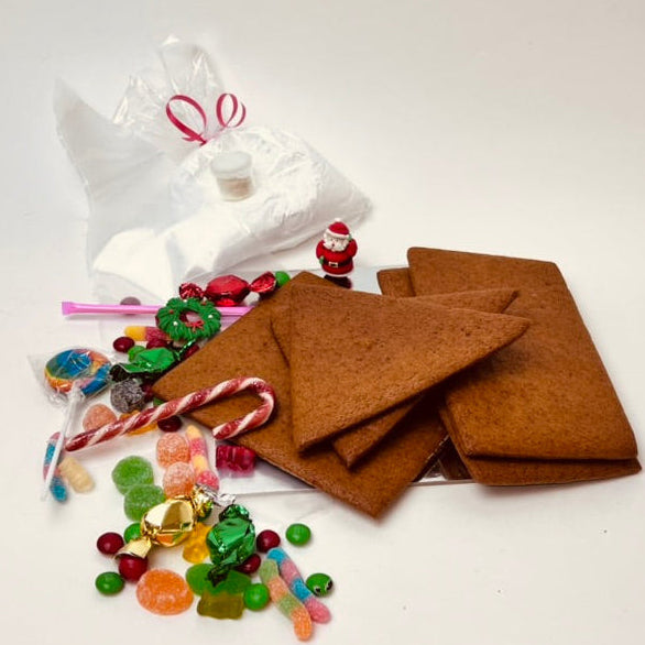 Gingerbread cookies, candy, and a plastic bag on a white background