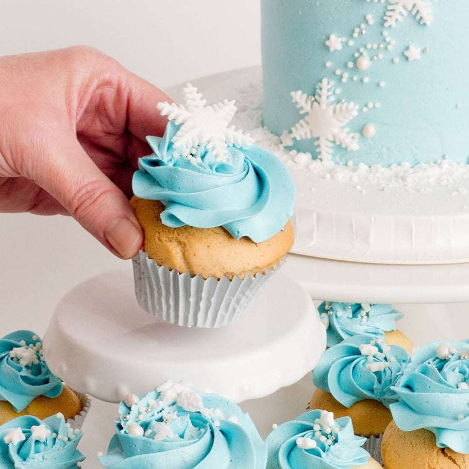 Cupcakes with light blue frosting, with a snow flake topper, perfect for a Disney Frozen themed birthday party, Birthday Cupcake Brisbane, Cute Cakes & Co, 