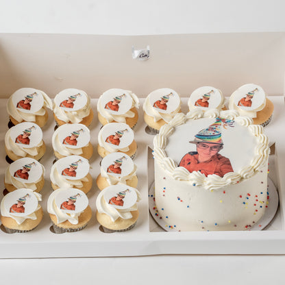 A custom birthday cake and matching mini cupcakes .The cake and cupcakes are decorated with white buttercream and topped with custom edible  toppers 