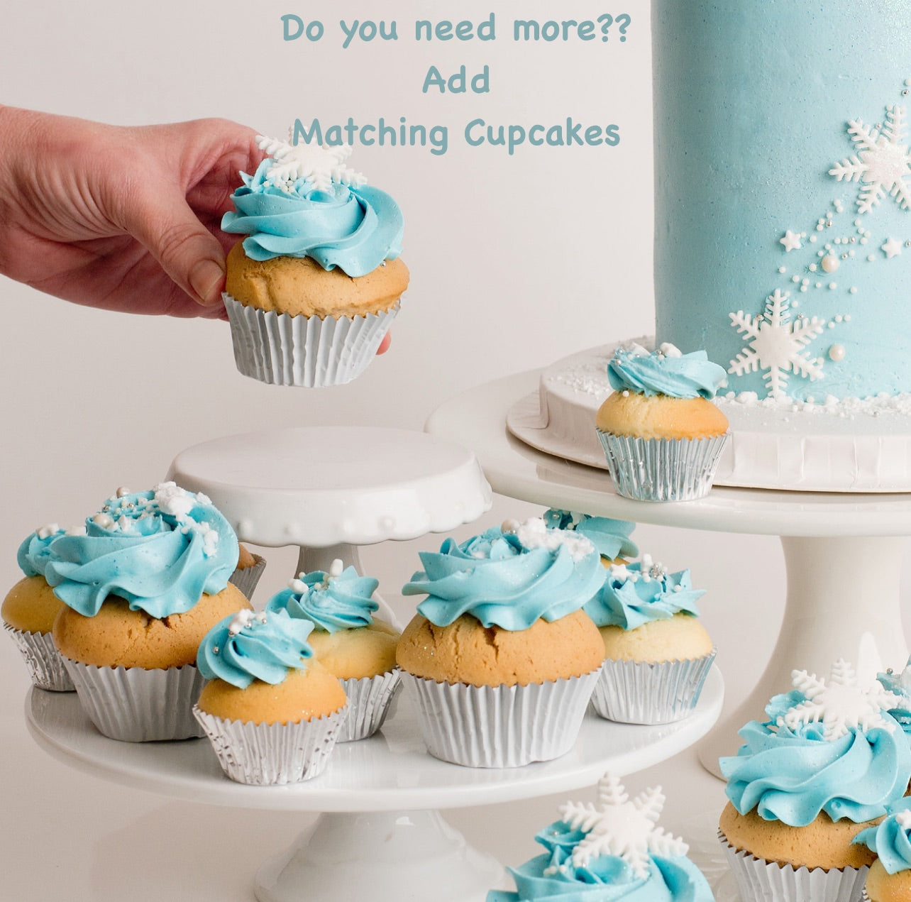 Disney Frozen themed cupcakes & cake iced in light blue buttercream with snowflakes stars and glitter perfect for a little girl's birthday Looks fabulous.   Made with love by the five star cake shop ,Cute Cakes and Co, Brisbane.  Mitchelton , Cake shop near you 