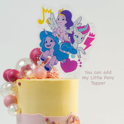 My Little pony cake topper on a pink and yellow cake