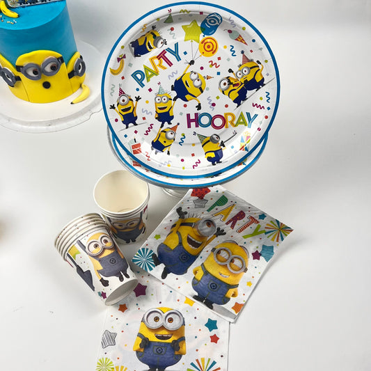 Party supplies with Minion design on plates, cups, and napkins.