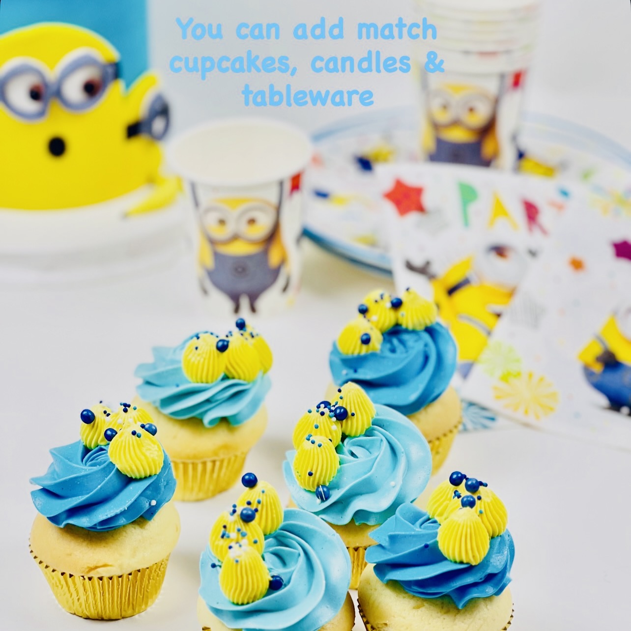 Minion birthday cake. Decorated with blue buttercream, three Despicable Me minions  characters on the front with icing bananas and stars as decoration.  Looks fabulous, Made with love by the five star cake shop ,Cute Cakes and Co, Brisbane. 