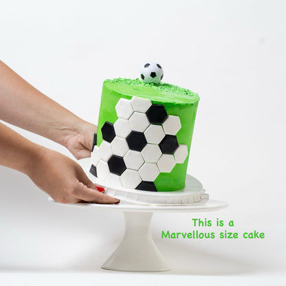 Soccer cake made with green buttercream with the soccer ball black-and-white pattern around the outside and a soccer ball on the top. Looks fabulous, Made with love by the five star cake shop ,Cute Cakes and Co, Brisbane. 