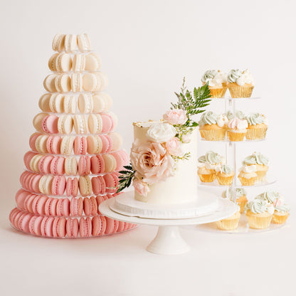 wedding setup display with a single tier wedding cake with fresh flowers on it. pink and white macaron tower . cupcake stand with sage green and white cupcake Beautiful birthday cakes and cupcakes, Cute Cakes and Co, Brisbane 
