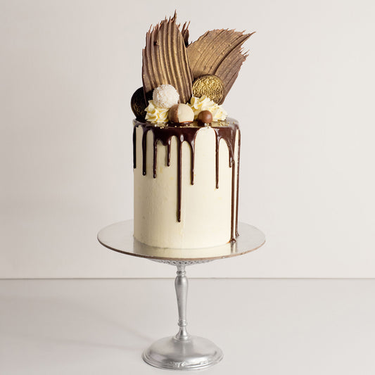 Jo Blanc cake with chocolate sails, pralines, Raffaello chocolates and Maltesers
