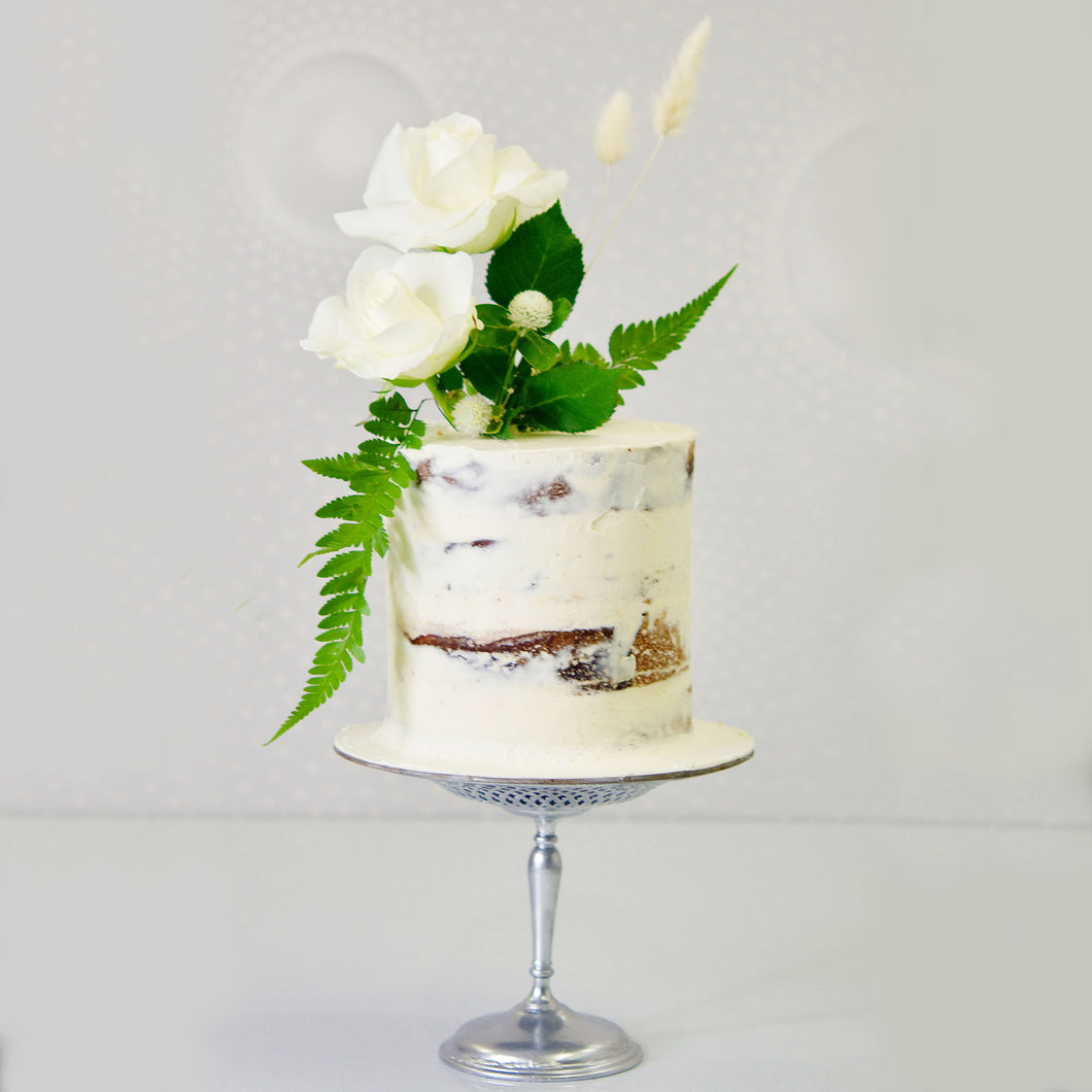Beautiful, elegant and charming semi-naked cake decorated with a sophisticated flower arrangement. Cute Cakes & Co, Cute Cakes and Co Brisbane.